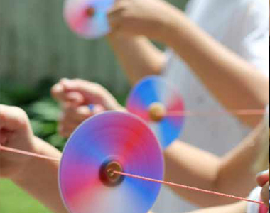 Make an old-fashioned button spinner using CD's.